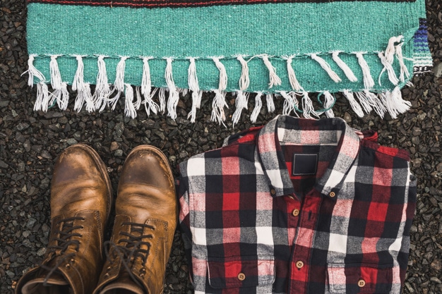 Boots, shirt, and blanket to bring during camping