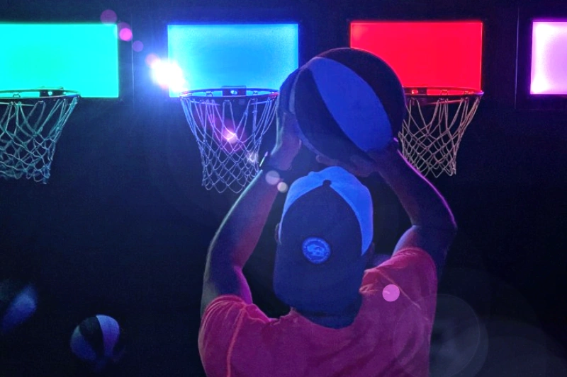 Teen shoots hoops at Activate Games