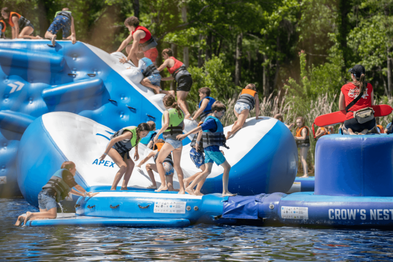 Families play on the water obstacle course at Charleston Aqua Park