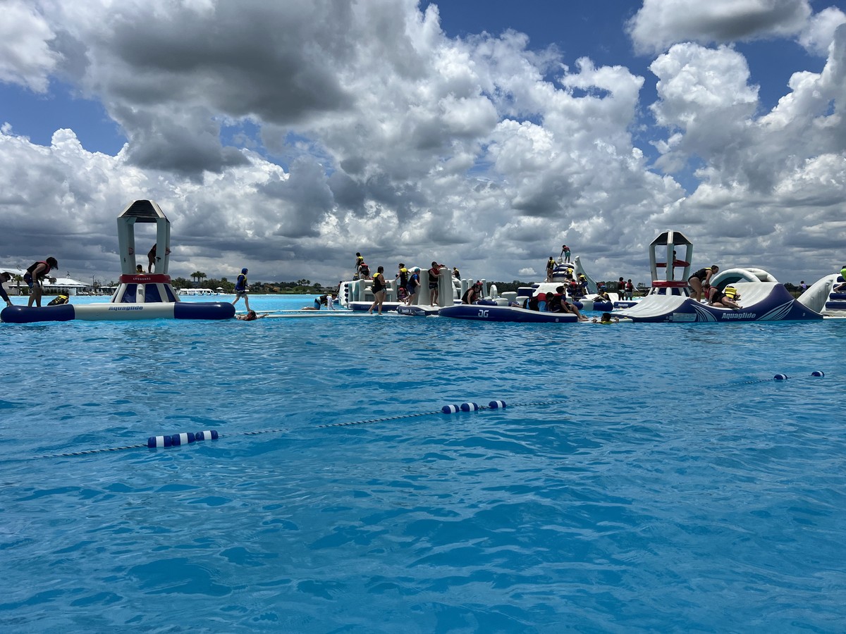 Kids play on the water obstacle course.