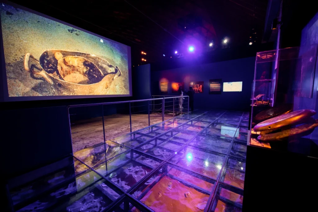 Peer into the depths at a recreation of the debris field, the final resting place for Titanic's artifacts.